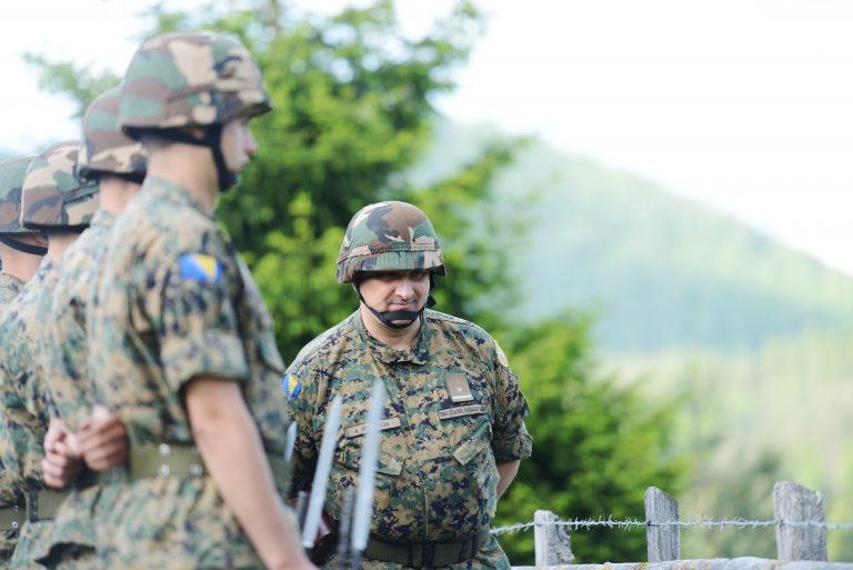 Soldiers with military camouflage uniform in army formation